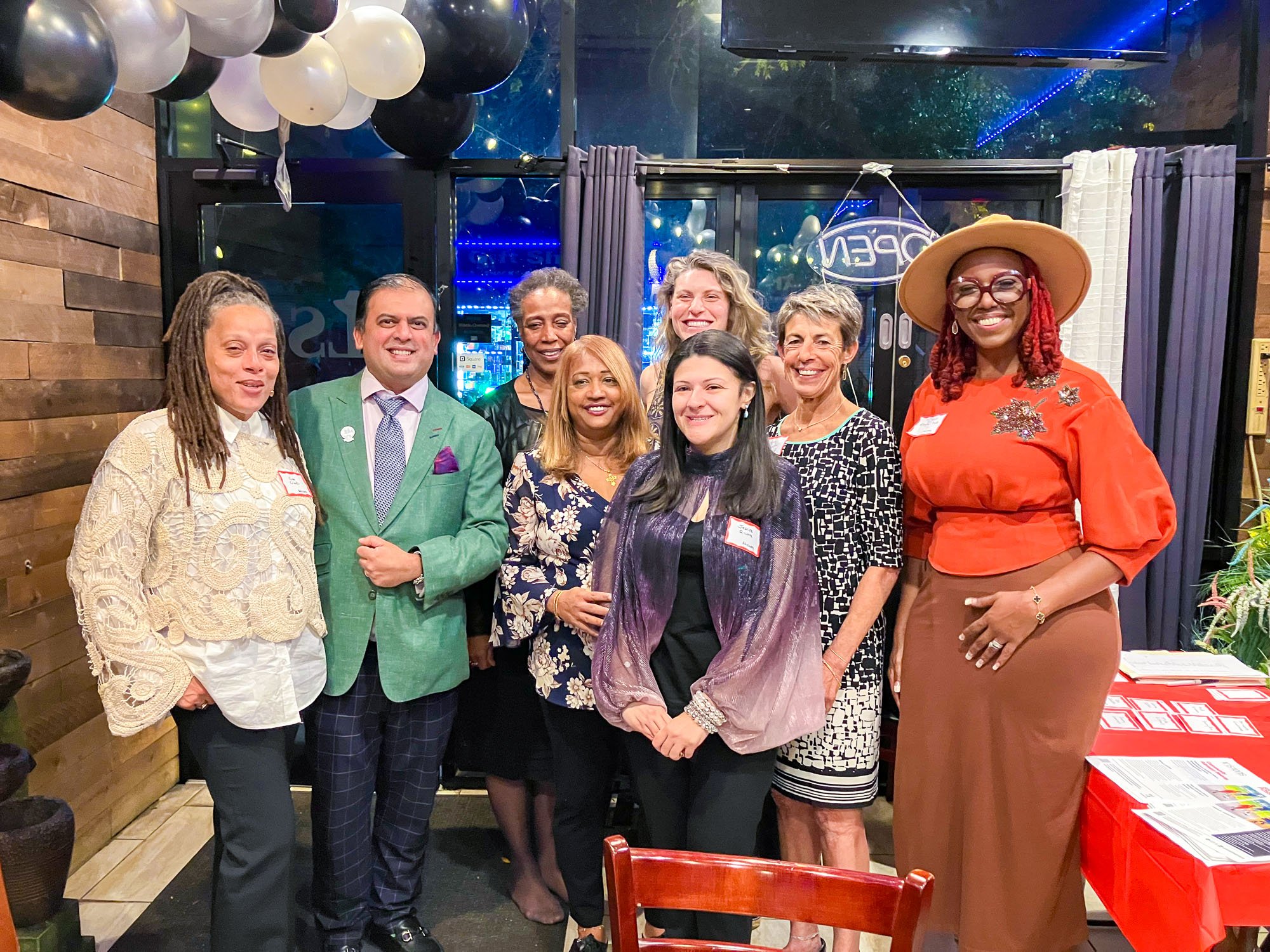 Photo of a group of Brooklyn Advisory Board members standing together, smiling to the camera.