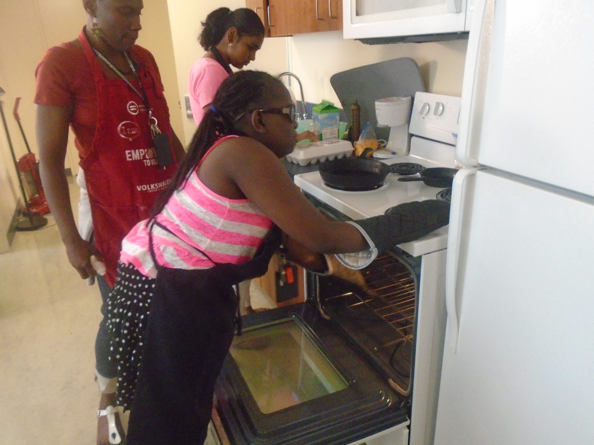 Chelsie preparing the oven