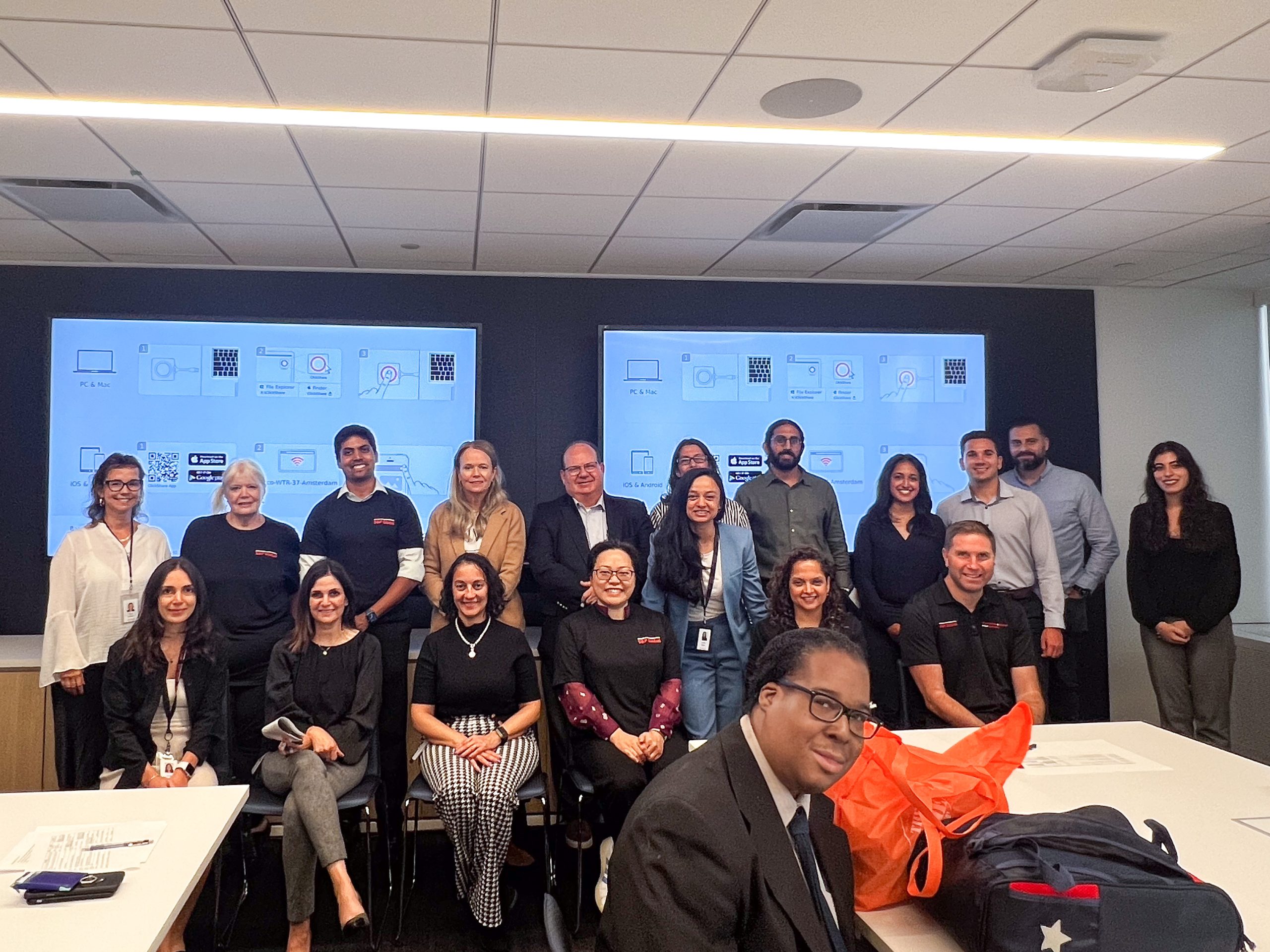 Group photo of S&P Global staff standing together smiling to the camera.